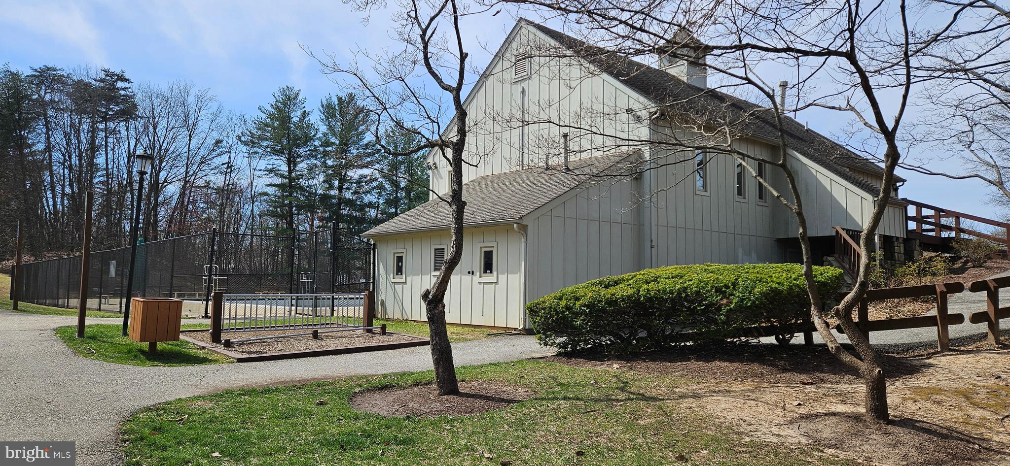 5831 Cove Landing Road, Unit 301 Burke, VA 22015 - Photo 30 of 33 a view of a house with backyard and a tree