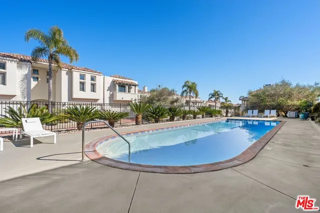 a view of a swimming pool with a patio