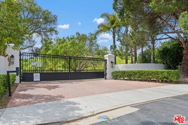 a view of a bench in a sidewalk