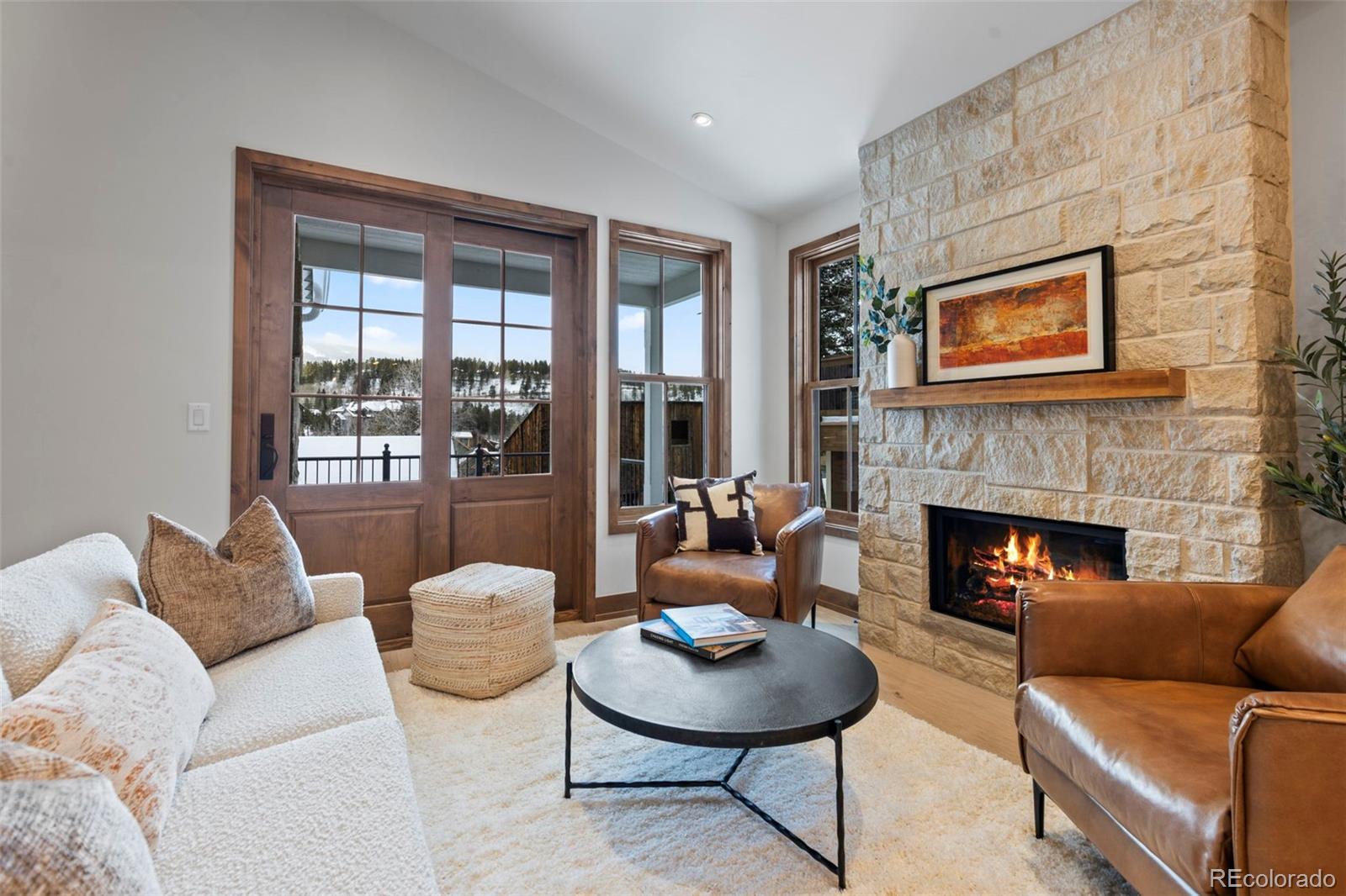203 North Ridge Street, Unit B Breckenridge, CO 80424 - Photo 16 of 41 a living room with furniture and a fireplace