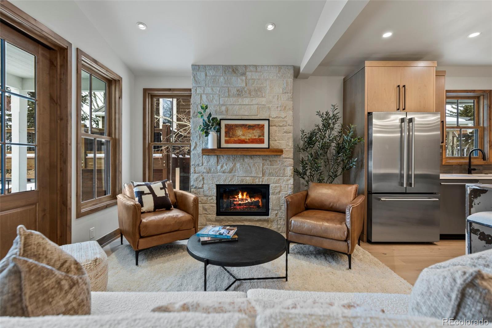 203 North Ridge Street, Unit B Breckenridge, CO 80424 - Photo 26 of 41 a living room with furniture and a fireplace