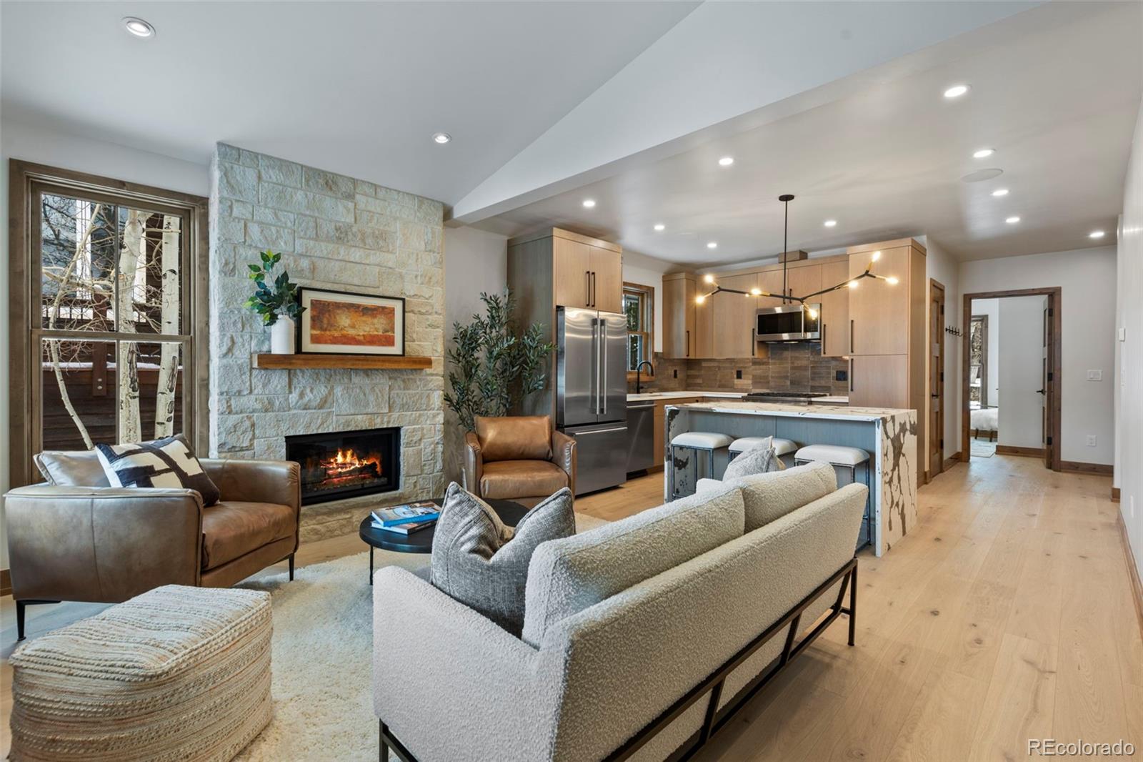 203 North Ridge Street, Unit B Breckenridge, CO 80424 - Photo 27 of 41 a living room with furniture and a fireplace