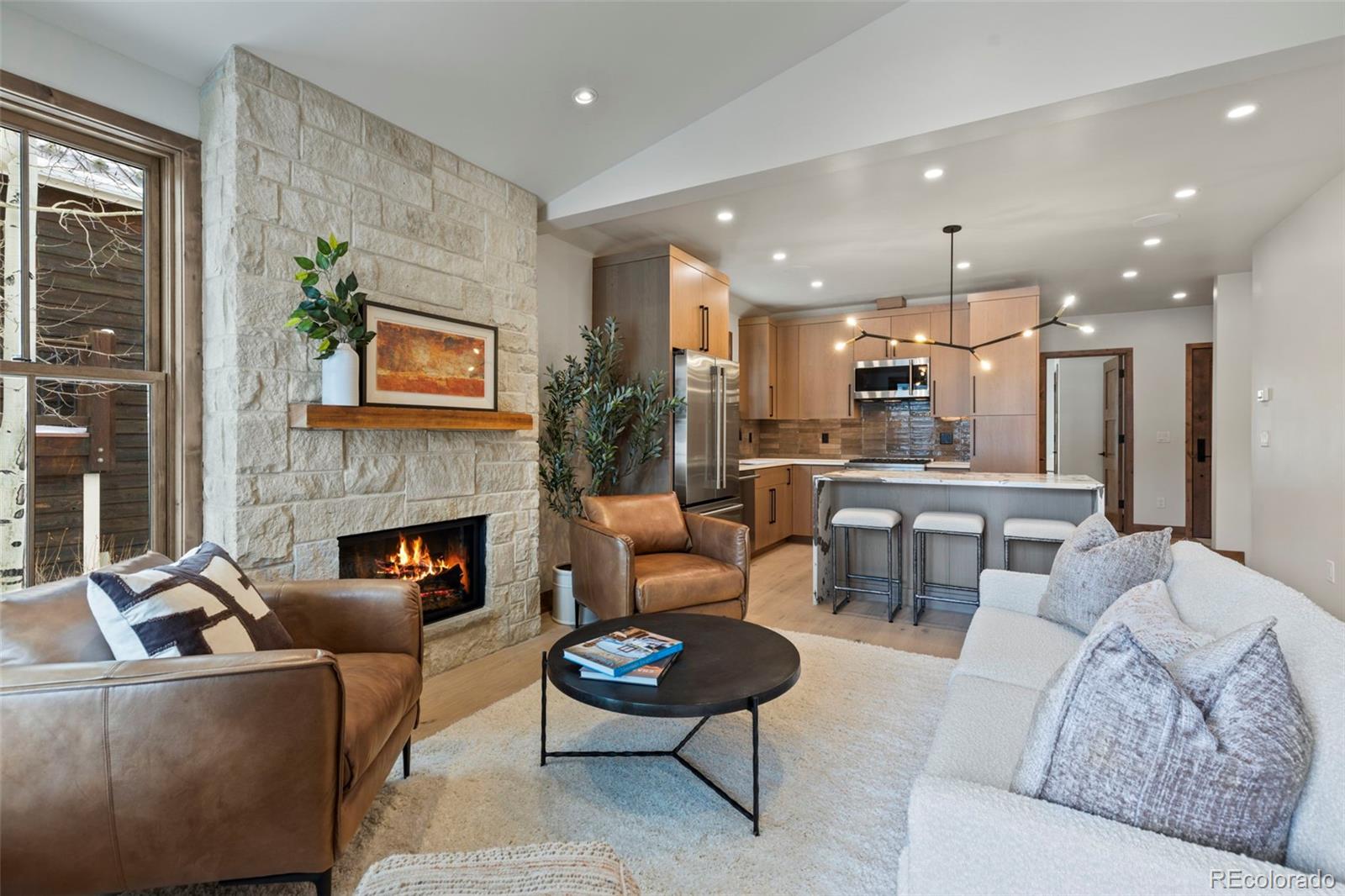 203 North Ridge Street, Unit B Breckenridge, CO 80424 - Photo 28 of 41 a living room with furniture and a fireplace