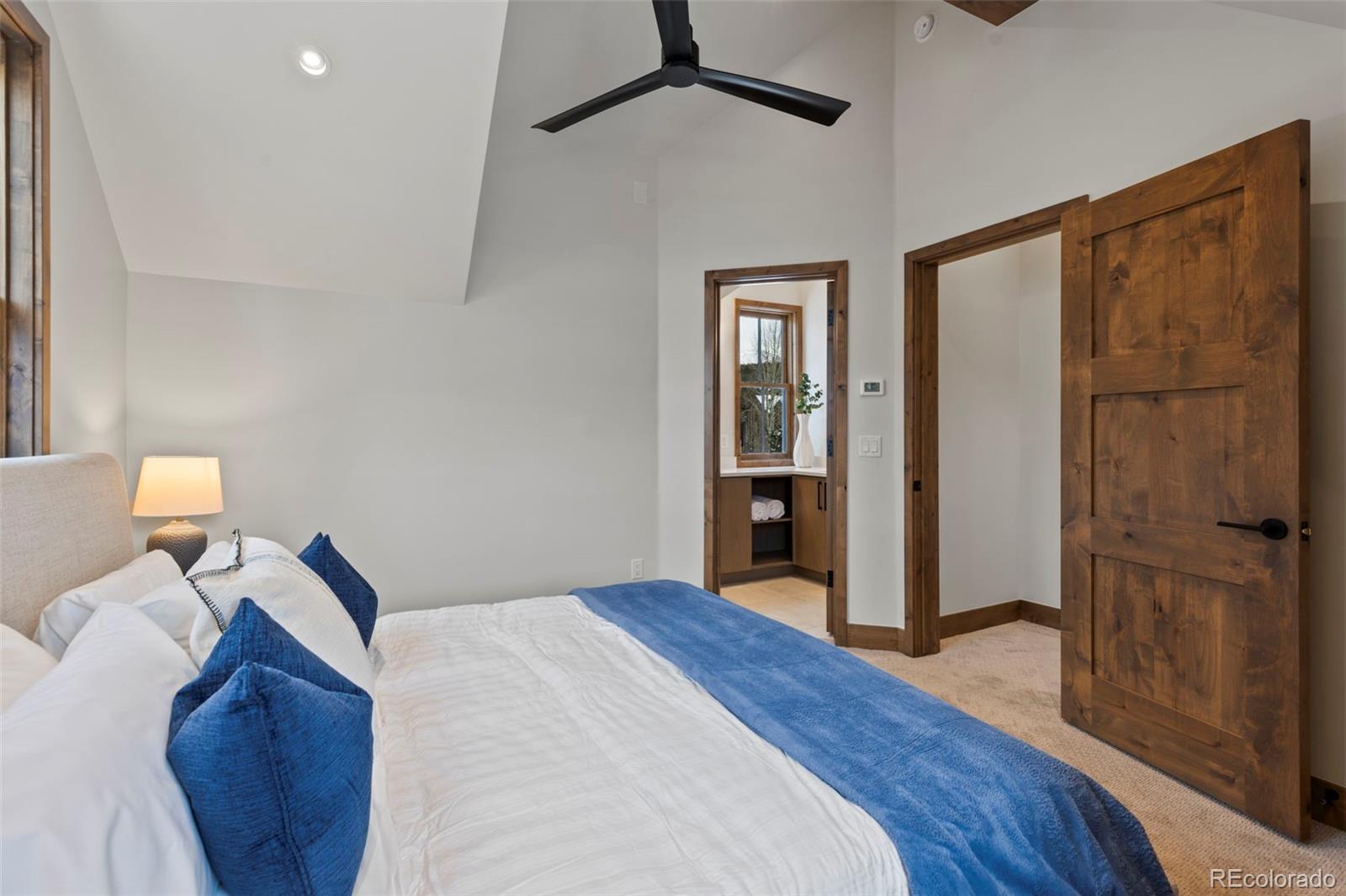 203 North Ridge Street, Unit B Breckenridge, CO 80424 - Photo 35 of 41 a bedroom with a bed and a dresser