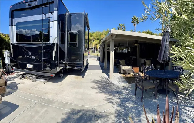 a view of a building with a tv on the table and chairs