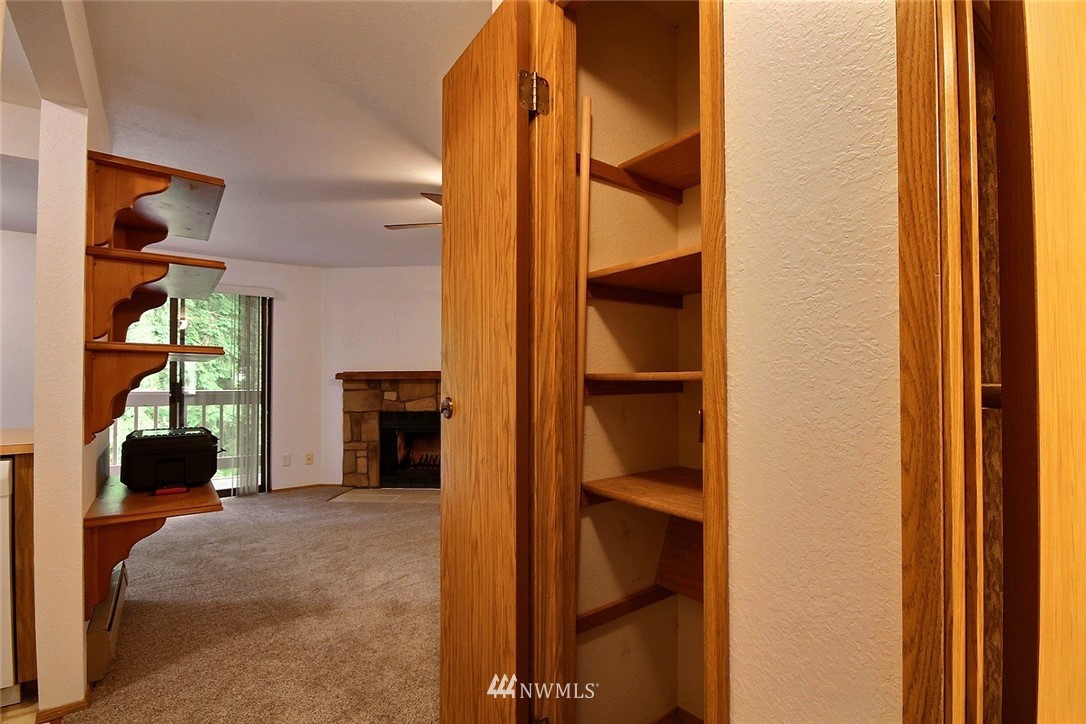 17419 119th Lane Southeast, Unit E31 Renton, WA 98058 - Photo 11 of 18 a view of an empty room with closet and a window