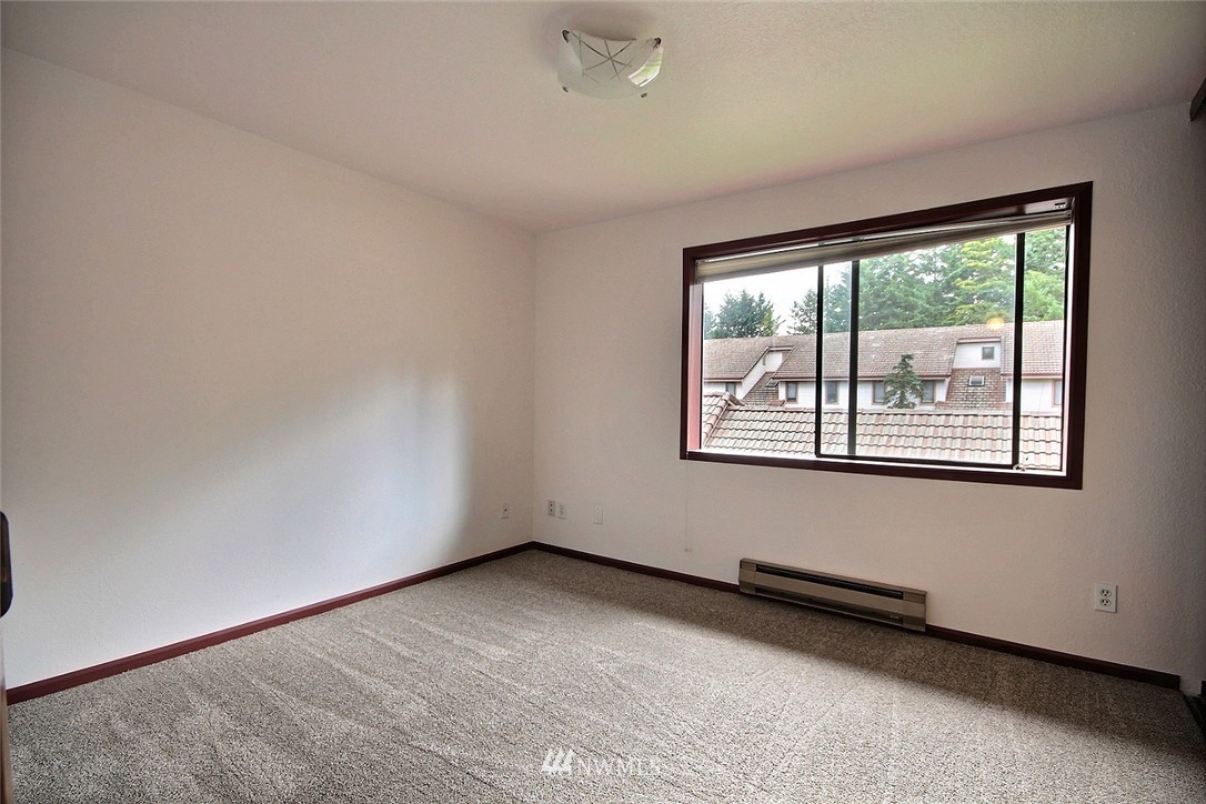 17419 119th Lane Southeast, Unit E31 Renton, WA 98058 - Photo 12 of 18 a view of an empty room with a window
