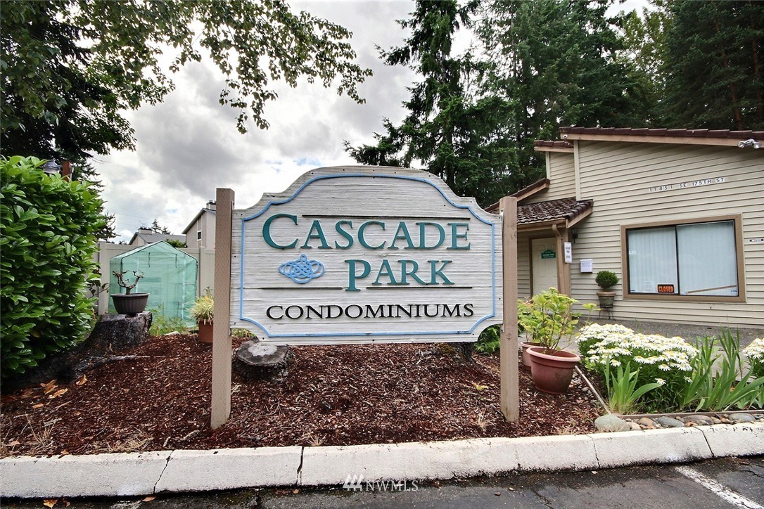 17419 119th Lane Southeast, Unit E31 Renton, WA 98058 - Photo 17 of 18 a sign on the side of a building