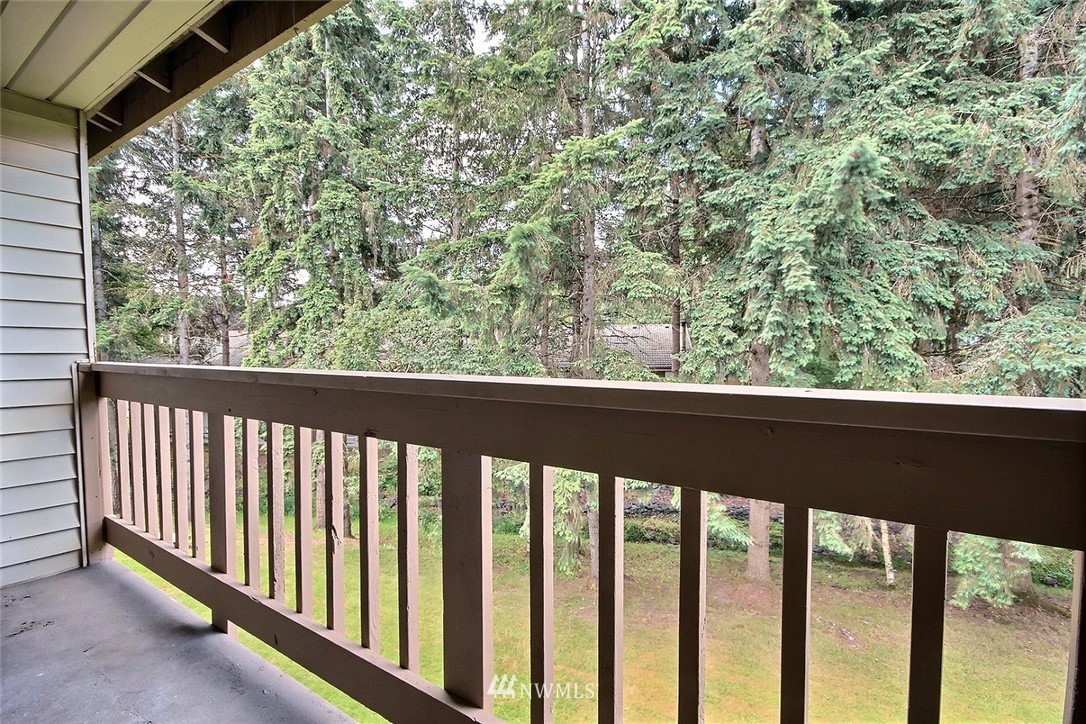 17419 119th Lane Southeast, Unit E31 Renton, WA 98058 - Photo 7 of 18 a view of a balcony with wooden floor