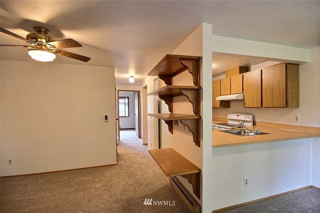 17419 119th Lane Southeast, Unit E31 Renton, WA 98058 - Photo 8 of 18 a en suite bathroom with a sink and mirror
