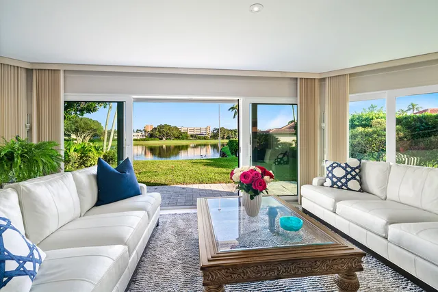 a view of a dining room and hall with furniture