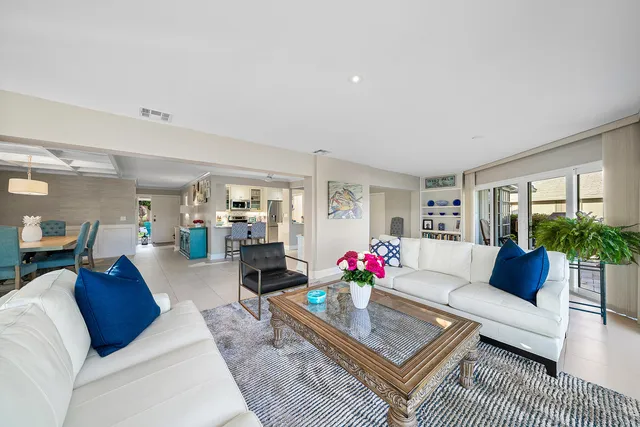 a kitchen with stainless steel appliances kitchen island granite countertop a sink and cabinets