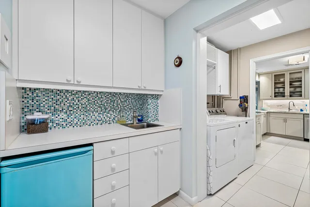 a kitchen with a sink stove and refrigerator
