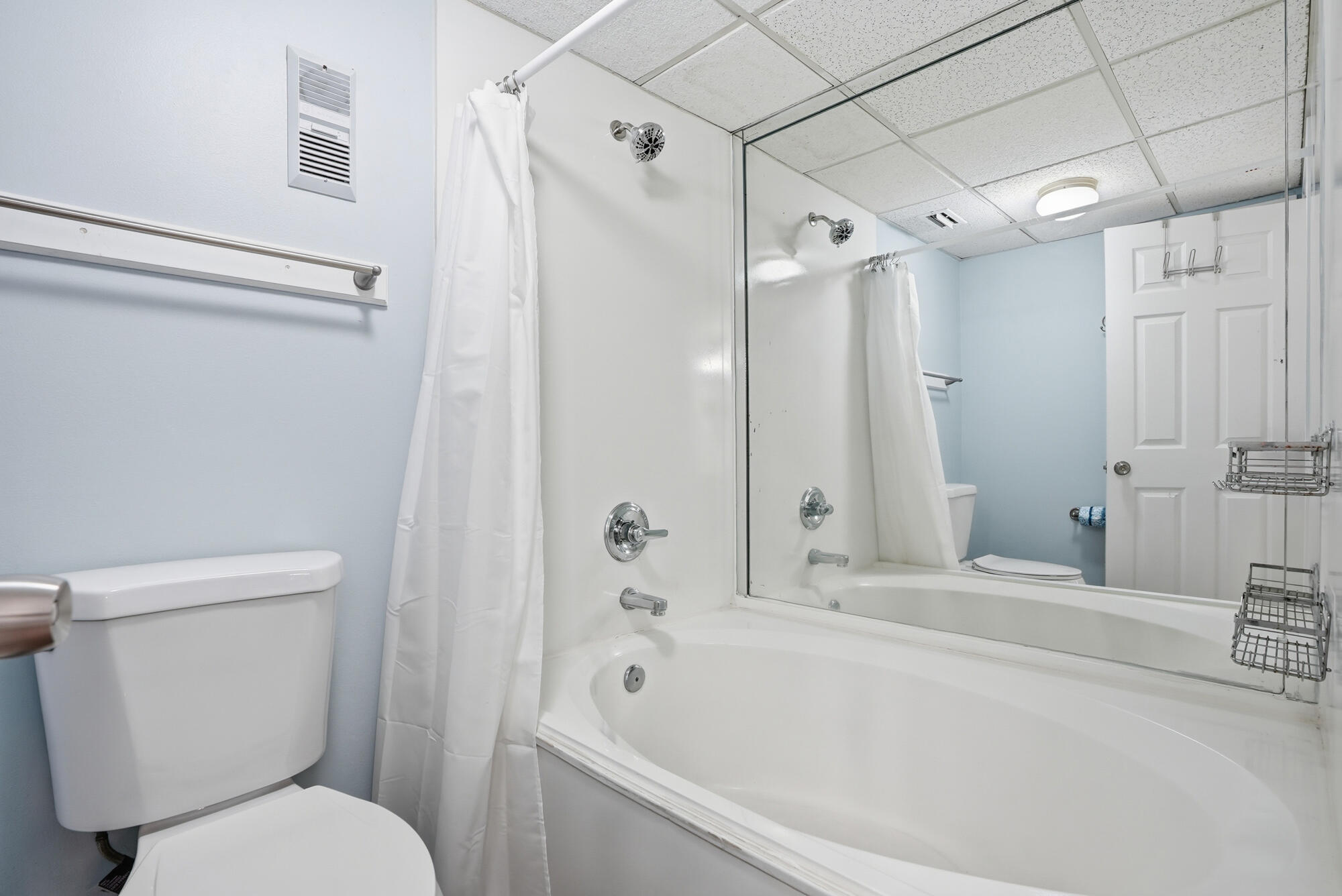 11483 Front Beach Road, Unit 105 Panama City Beach, FL 32407 - Photo 15 of 41 a bathroom with a toilet and a bathtub