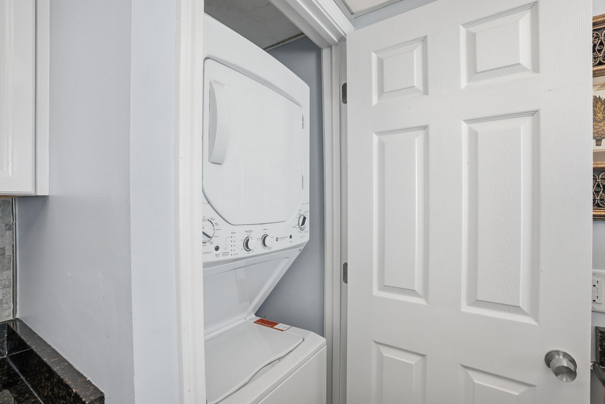 11483 Front Beach Road, Unit 105 Panama City Beach, FL 32407 - Photo 19 of 41 a bathroom with a sink a mirror and a shower