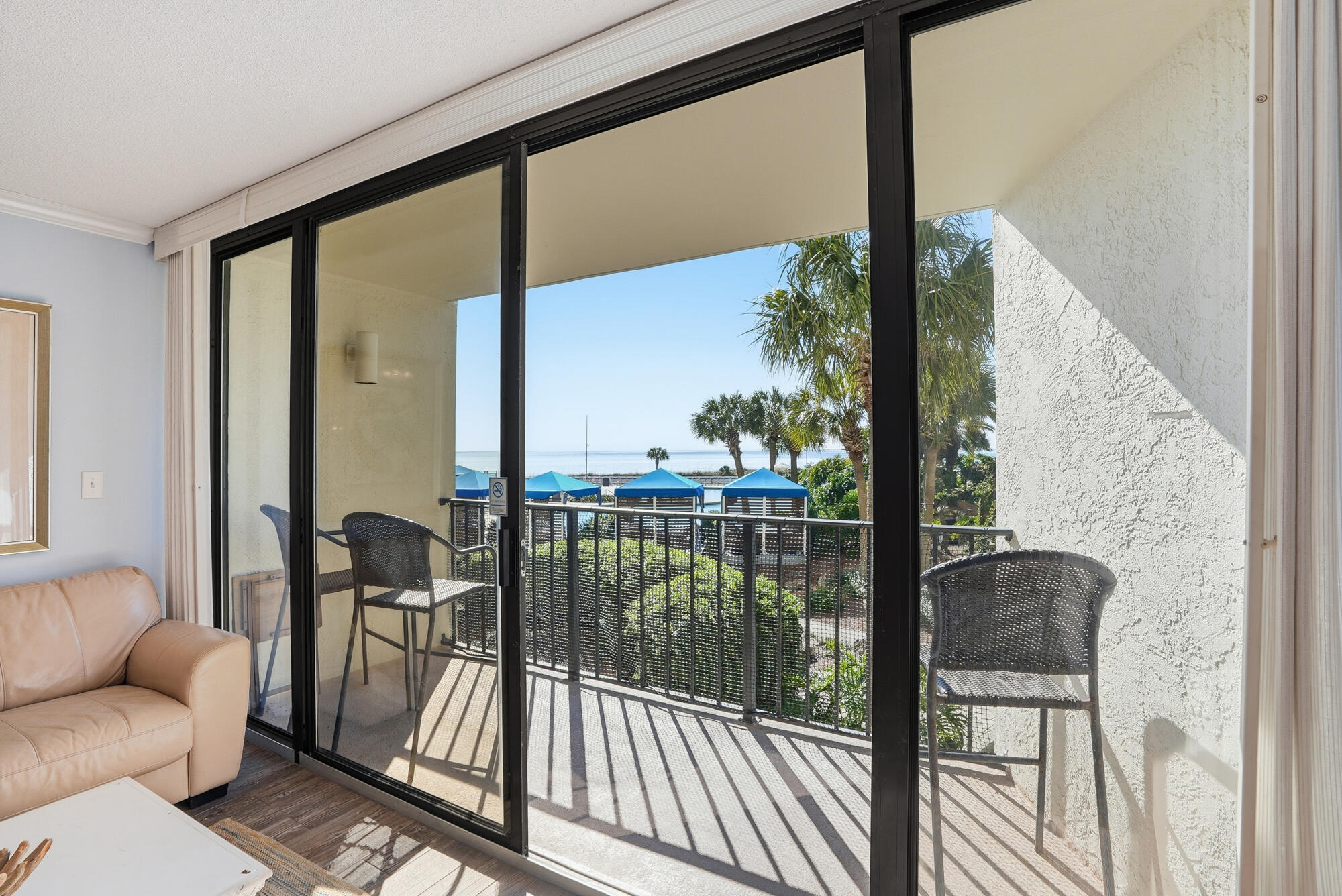 11483 Front Beach Road, Unit 105 Panama City Beach, FL 32407 - Photo 21 of 41 a view of a balcony with furniture