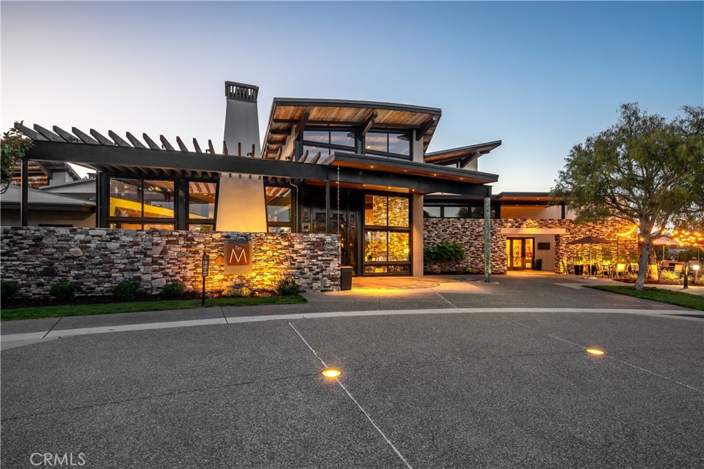 1650 Eucalyptus Road Nipomo, CA 93444 - Photo 55 of 60 a front view of a house with a yard and garage