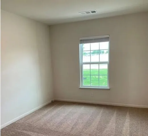a view of a small space with wooden floor