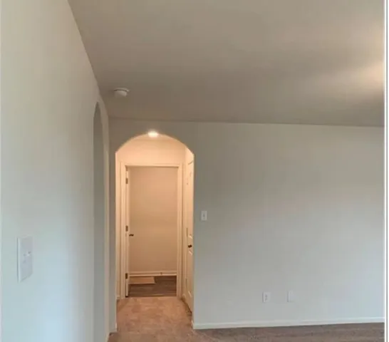 a view of a room that has a large window