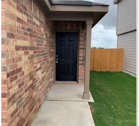 a view of entrance gate of a house