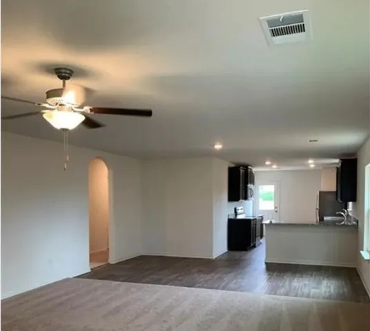 a view of a livingroom with a kitchen