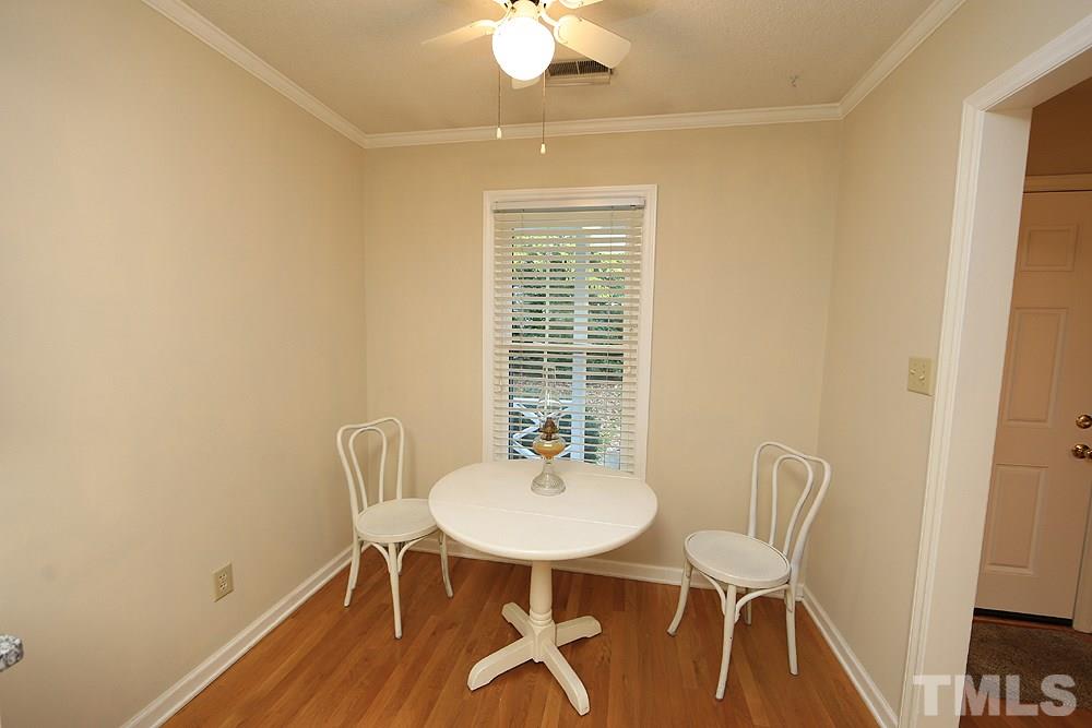 202 Bracken Court Raleigh, NC 27615 - Photo 5 of 19 Kitchen offers an eat-in space that's large enough for everyday meals. Beautiful hardwoods and 2-in window blinds found here.
