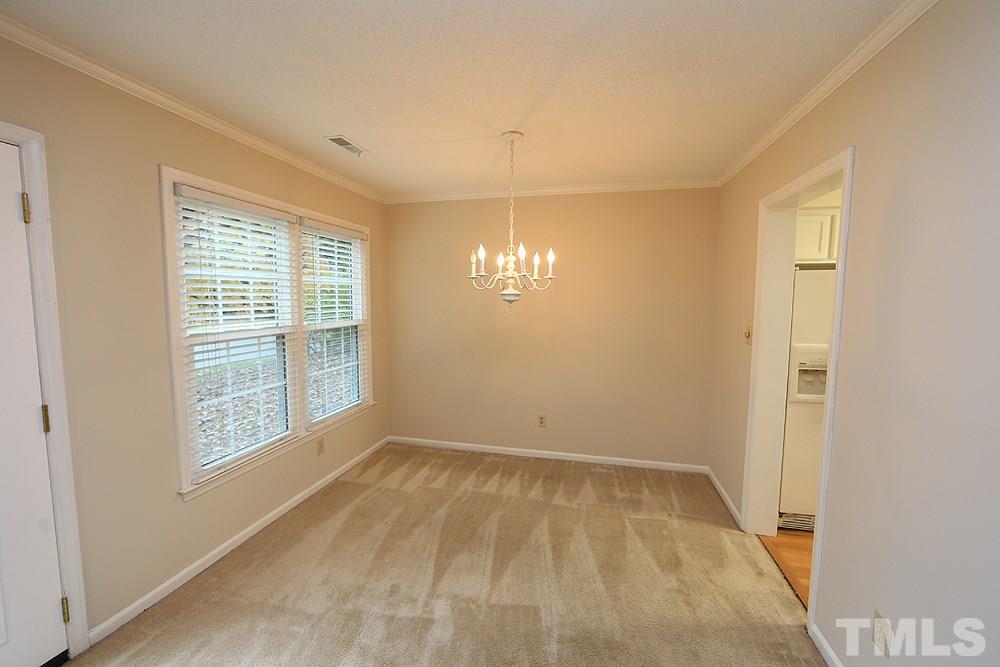 202 Bracken Court Raleigh, NC 27615 - Photo 7 of 19 Located directly off the Kitchen, this large Dining Room is the perfect gathering space.