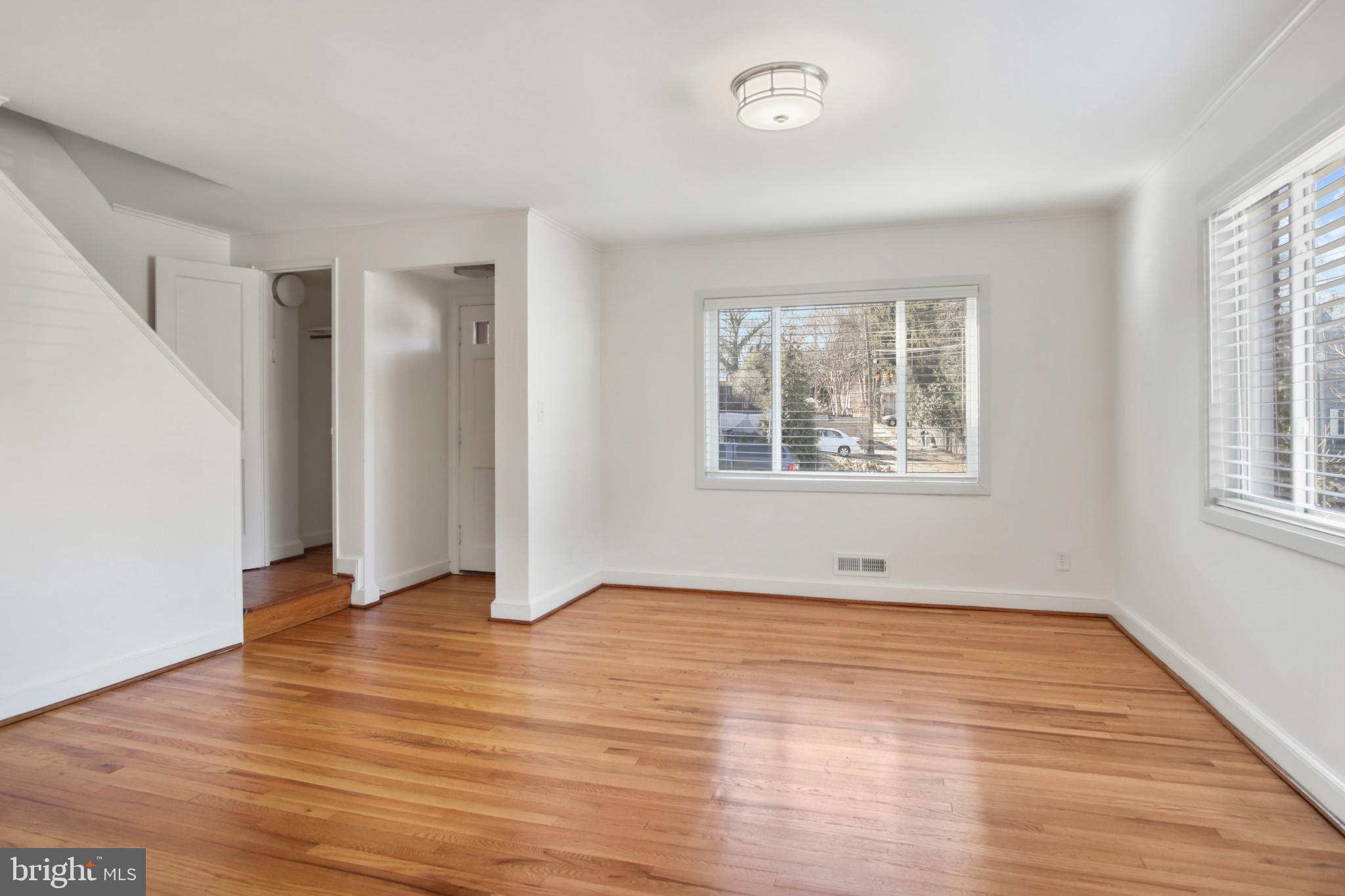 69 Aigburth Avenue Towson, MD 21286 - Photo 11 of 33 an empty room with wooden floor and windows