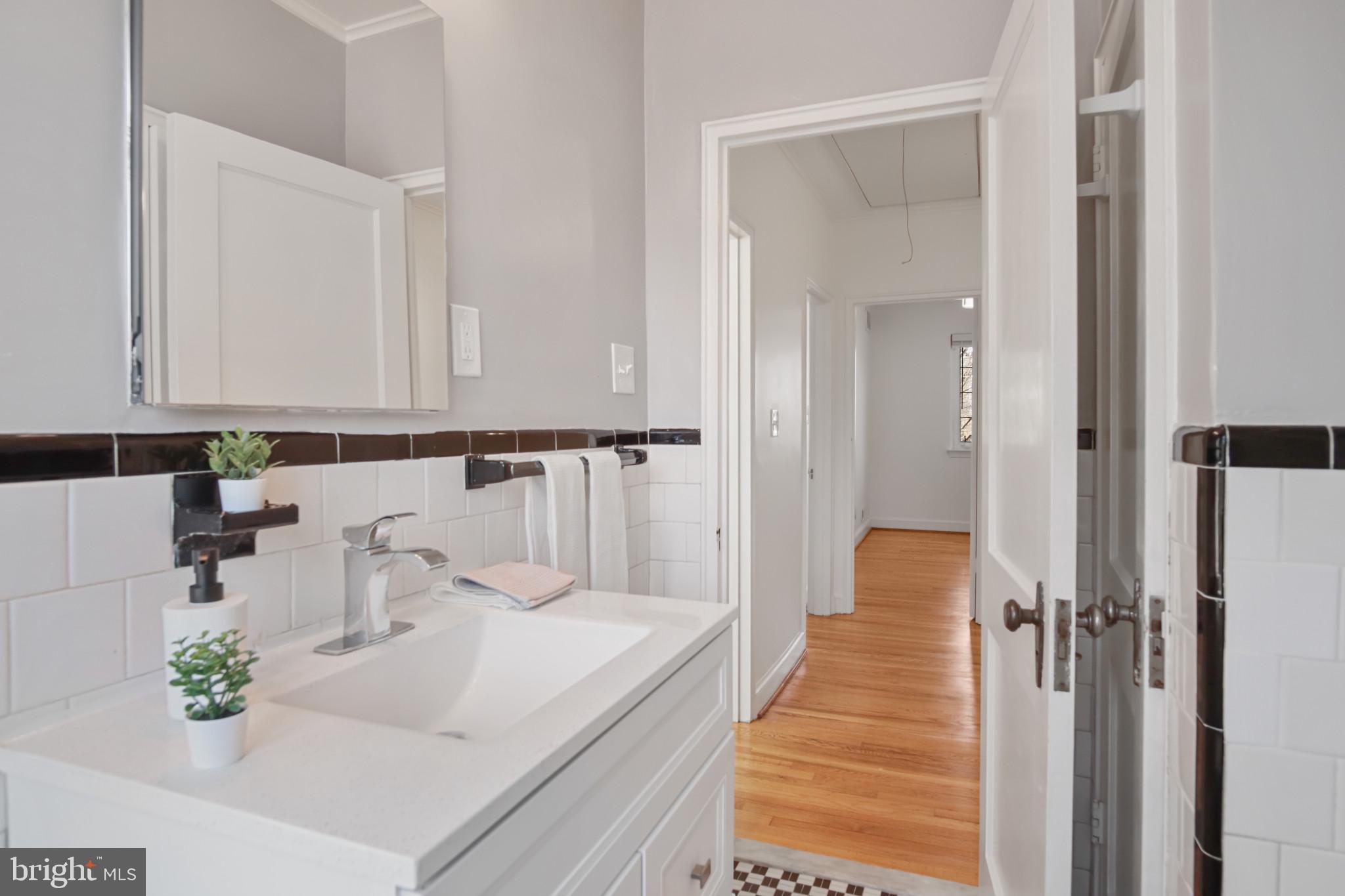69 Aigburth Avenue Towson, MD 21286 - Photo 14 of 33 a view of a bathroom with sink and mirror