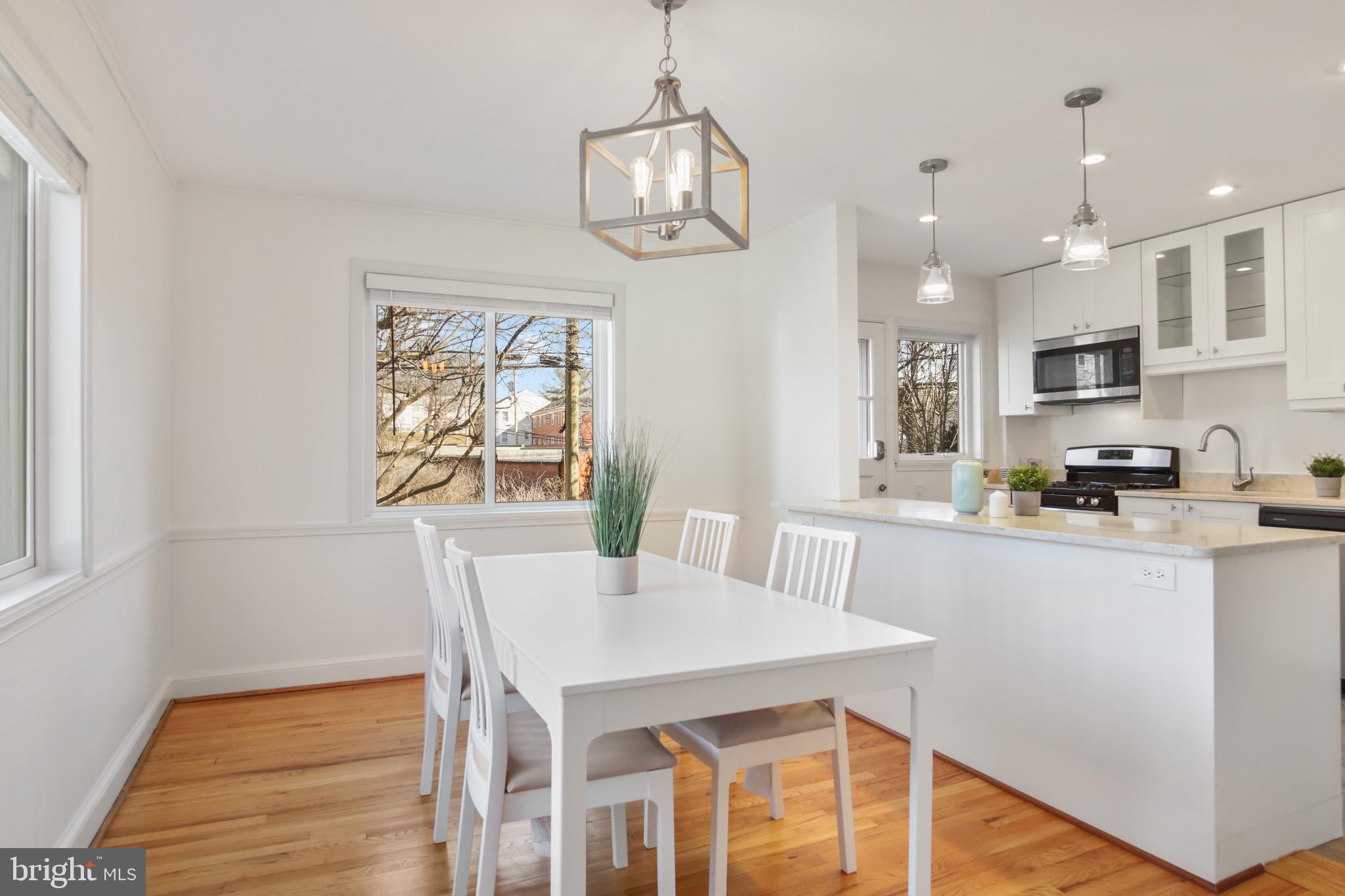 69 Aigburth Avenue Towson, MD 21286 - Photo 5 of 33 a view of a dining room with furniture a chandelier and wooden floor