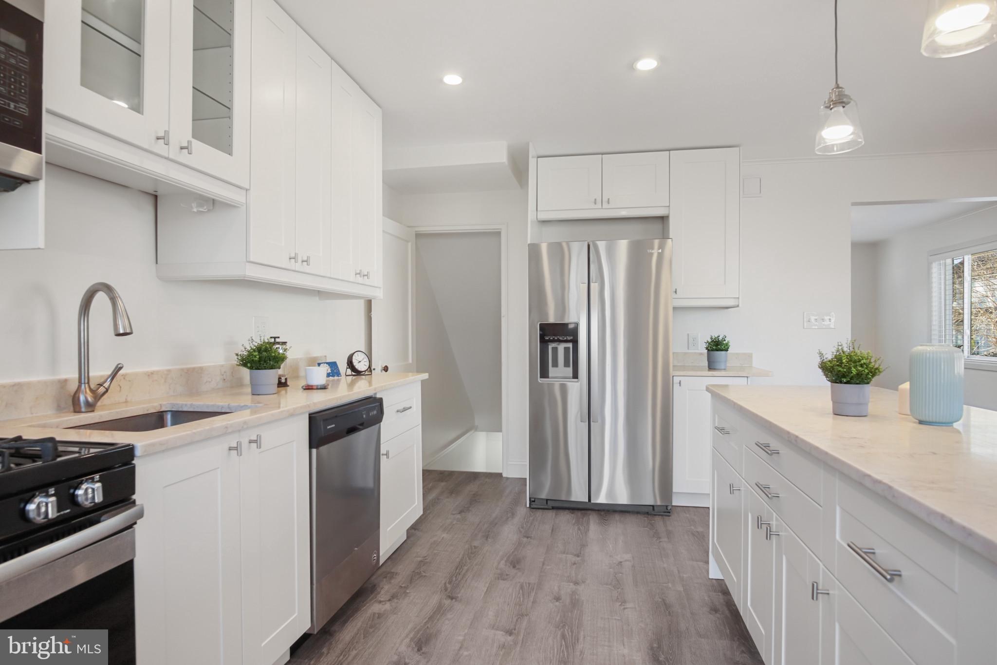 69 Aigburth Avenue Towson, MD 21286 - Photo 7 of 33 a kitchen with a sink white cabinets and stainless steel appliances