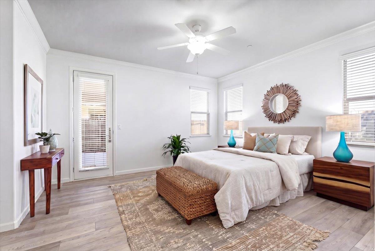 2036 Vignolia Loop Roseville, CA 95747 - Photo 16 of 27 a bedroom with bed and a chandelier
