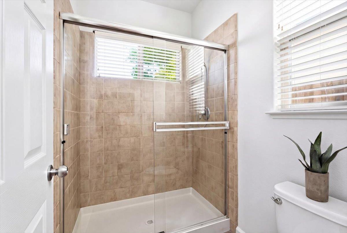 2036 Vignolia Loop Roseville, CA 95747 - Photo 18 of 27 a bathroom with a shower and a sink