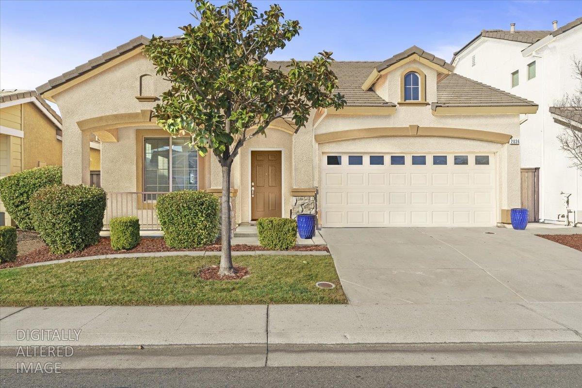 2036 Vignolia Loop Roseville, CA 95747 - Photo 2 of 33 Shadow from tree on garage door was removed.