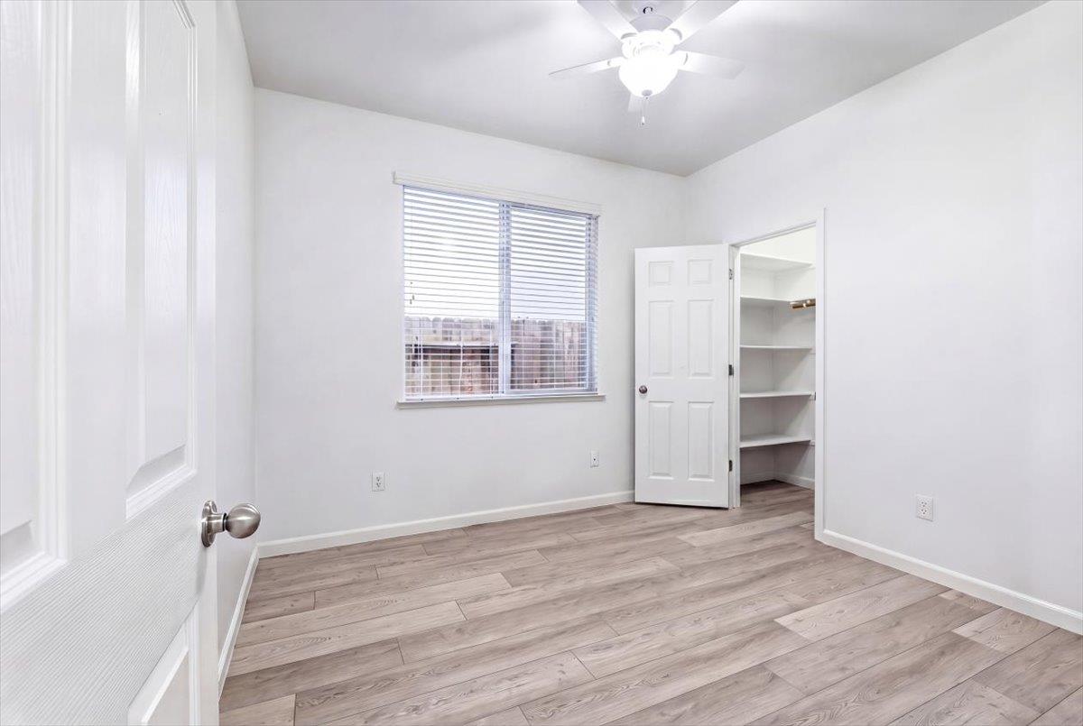 2036 Vignolia Loop Roseville, CA 95747 - Photo 21 of 27 a view of empty room with wooden floor and fan