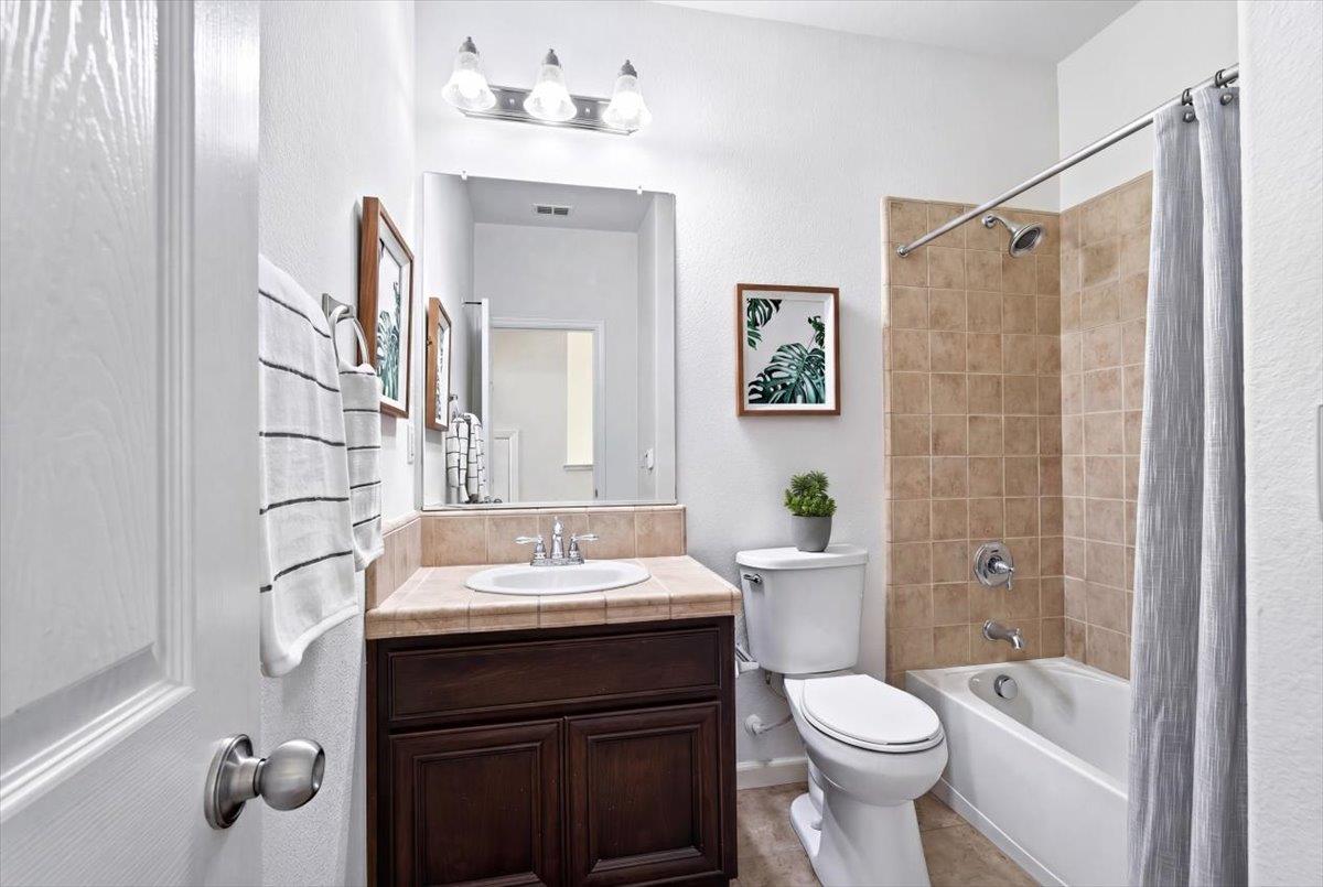 2036 Vignolia Loop Roseville, CA 95747 - Photo 25 of 27 a bathroom with a sink toilet and shower