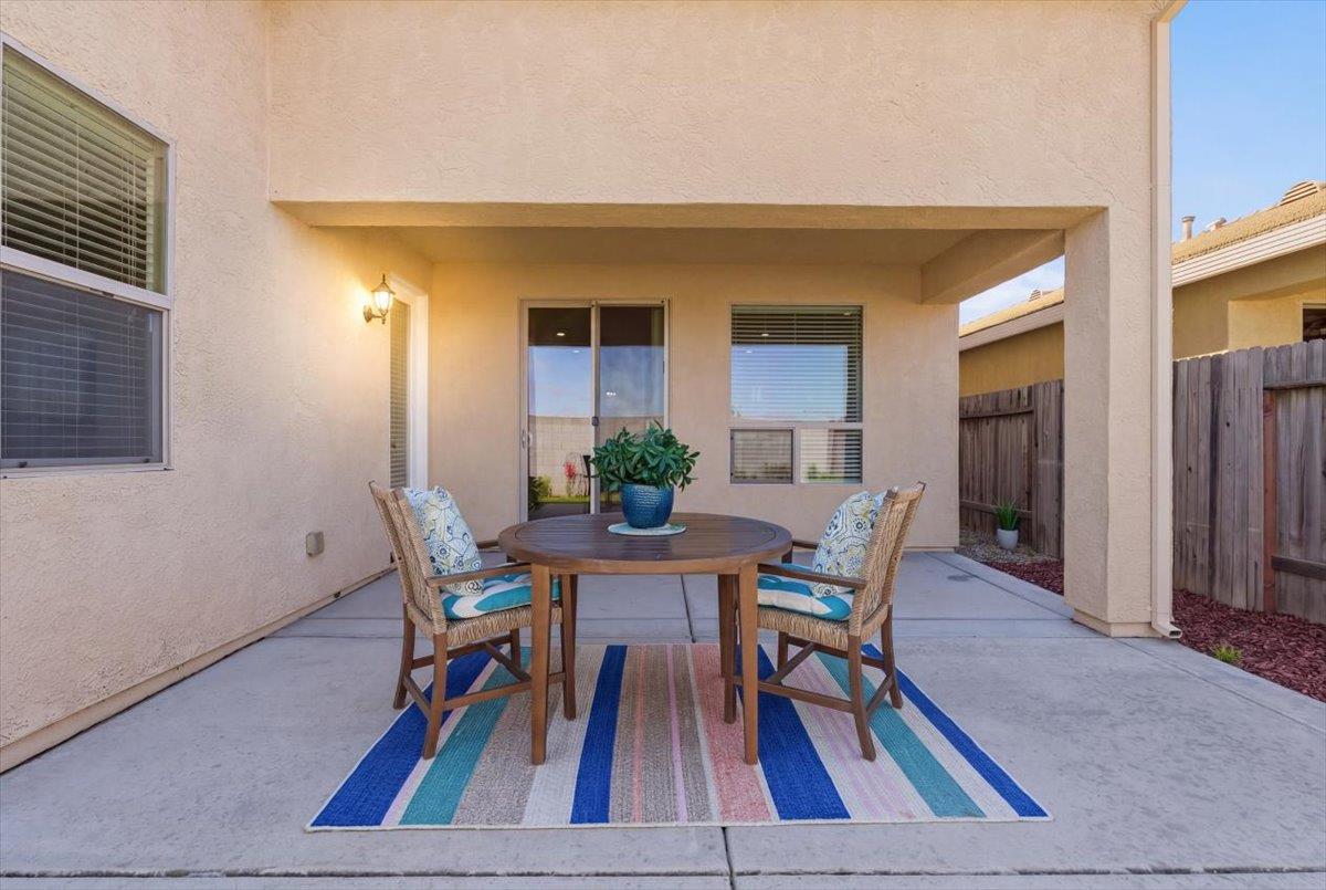 2036 Vignolia Loop Roseville, CA 95747 - Photo 26 of 27 a view of a dining room with furniture and wooden floor