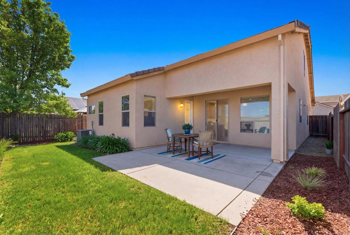 2036 Vignolia Loop Roseville, CA 95747 - Photo 27 of 27 a view of a backyard with a patio and outdoor seating
