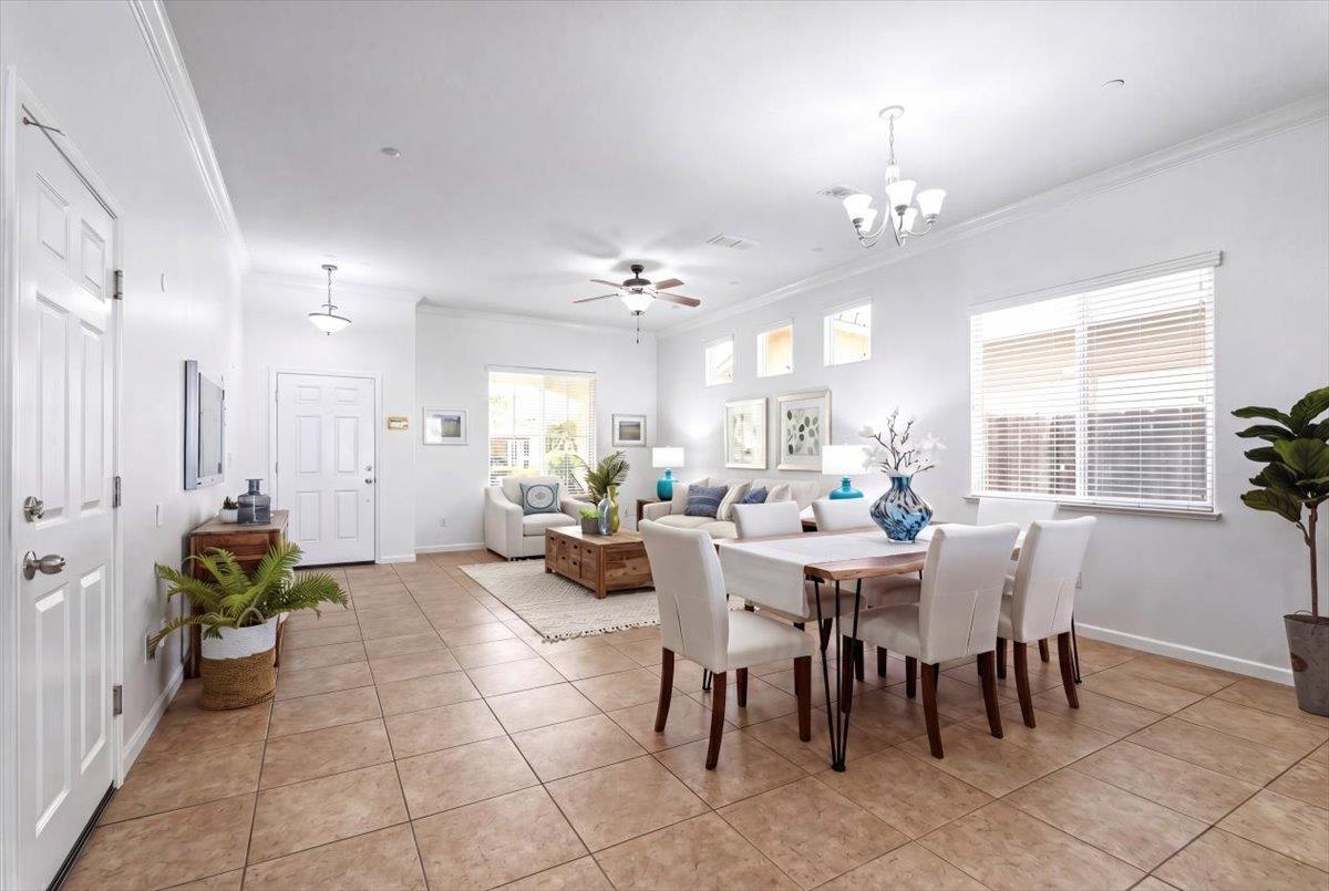 2036 Vignolia Loop Roseville, CA 95747 - Photo 6 of 27 a view of a dining room with furniture and a chandelier