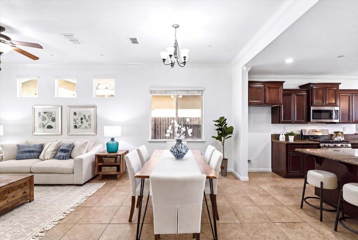 2036 Vignolia Loop Roseville, CA 95747 - Photo 7 of 27 a living room with furniture or chandelier and a wooden floor