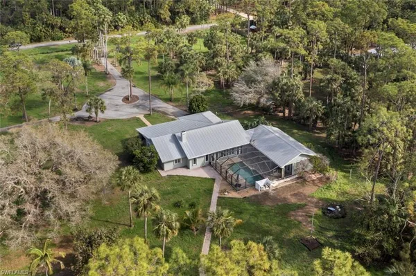 an aerial view of residential house with outdoor space