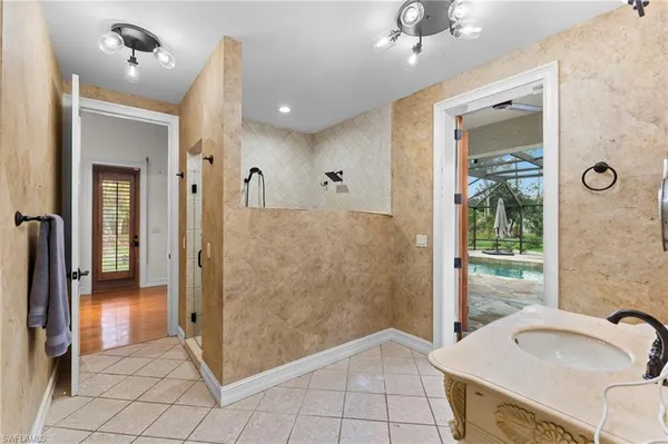 a bathroom with a tub and shower