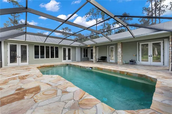 a view of a house with a swimming pool