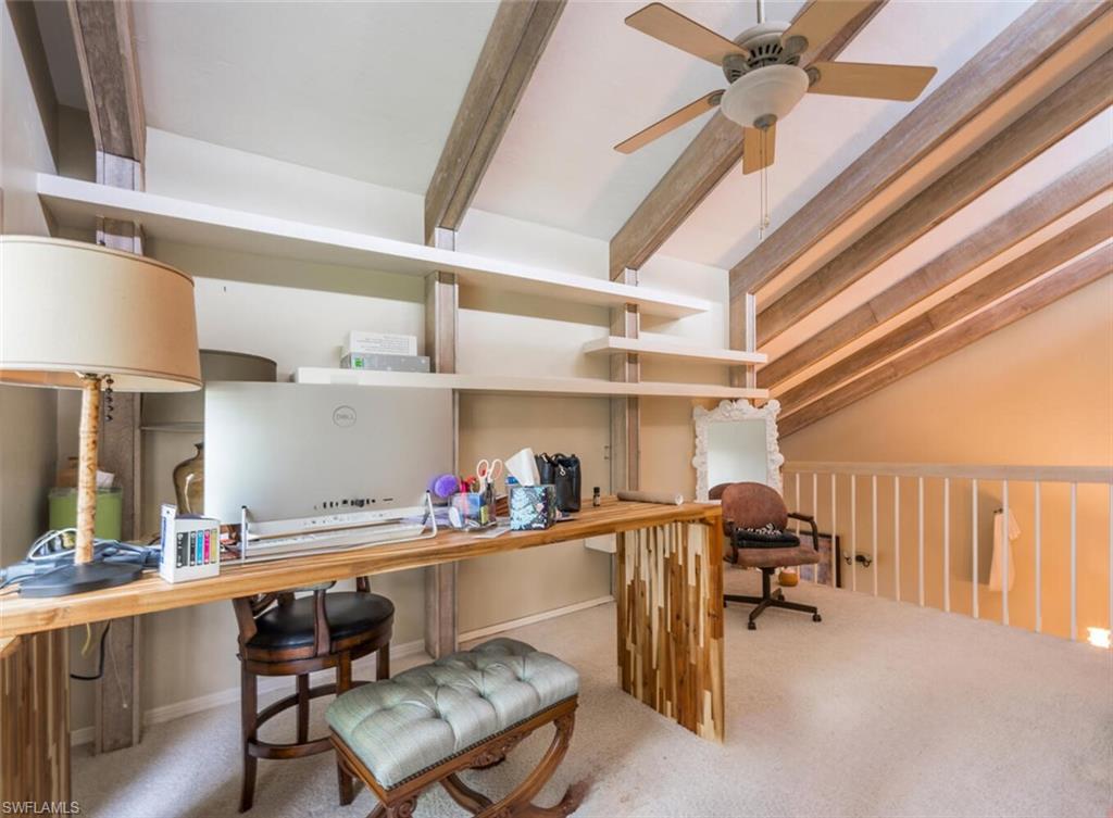 646 Augusta Boulevard Naples, FL 34113 - Photo 14 of 23 a room with stainless steel appliances a dining table chairs and a stove