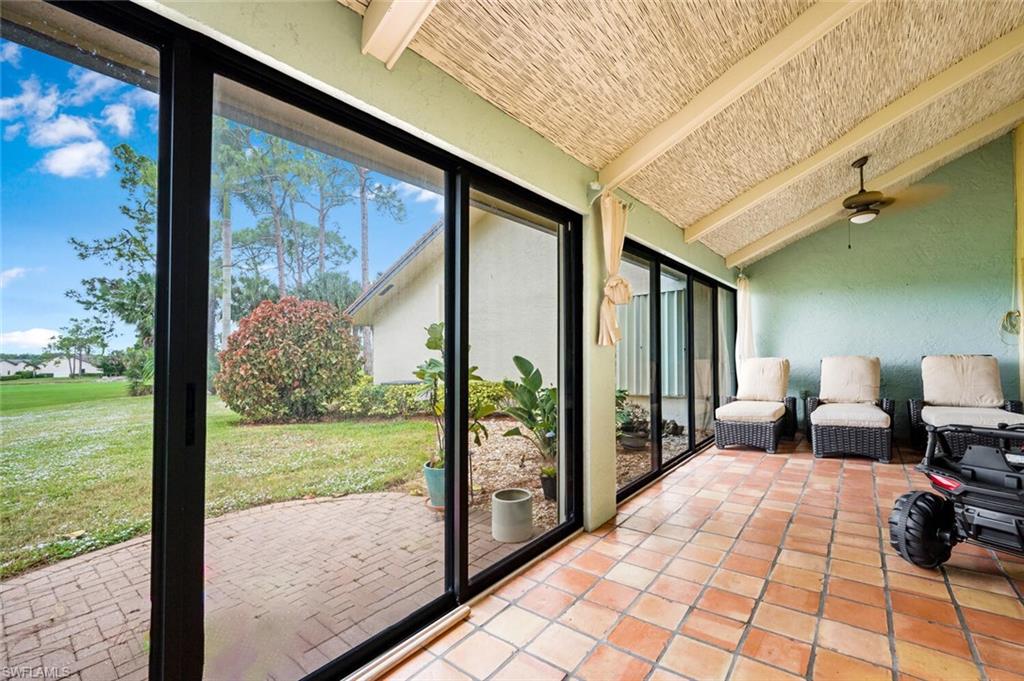646 Augusta Boulevard Naples, FL 34113 - Photo 15 of 23 a bedroom with furniture and large window