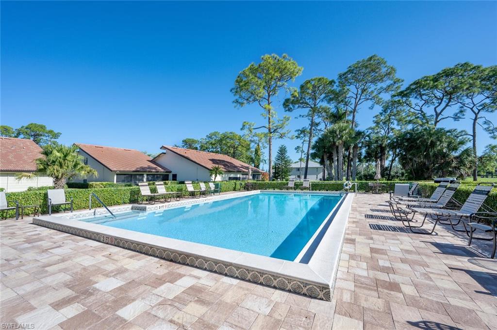 646 Augusta Boulevard Naples, FL 34113 - Photo 22 of 23 a view of swimming pool with lawn chairs and plants