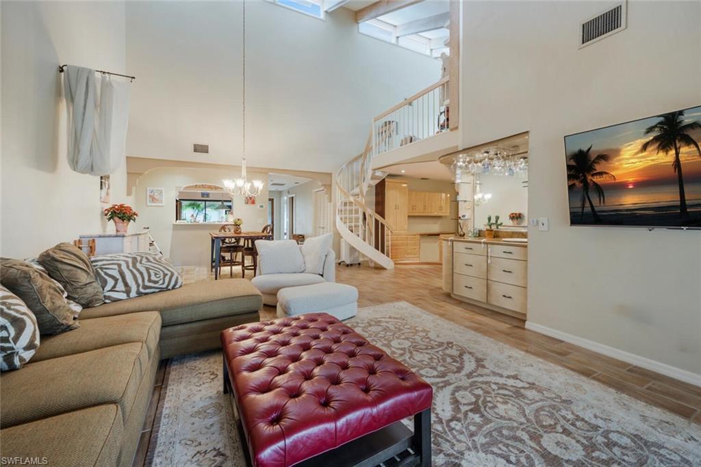 646 Augusta Boulevard Naples, FL 34113 - Photo 6 of 23 a living room with furniture and a flat screen tv
