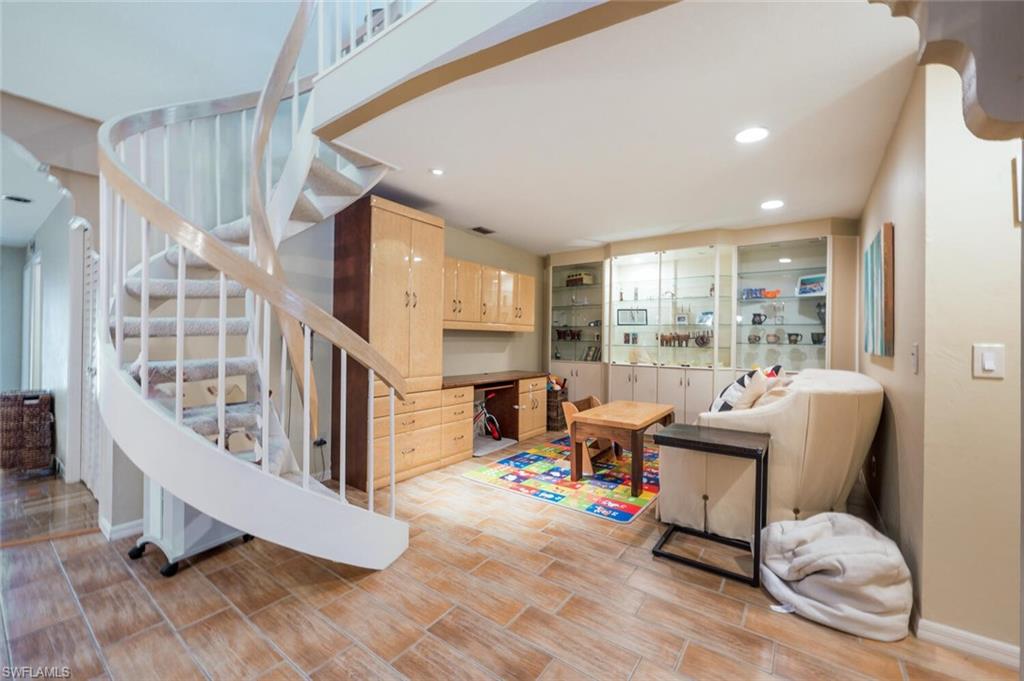 646 Augusta Boulevard Naples, FL 34113 - Photo 7 of 23 a living room with furniture and a wooden floor