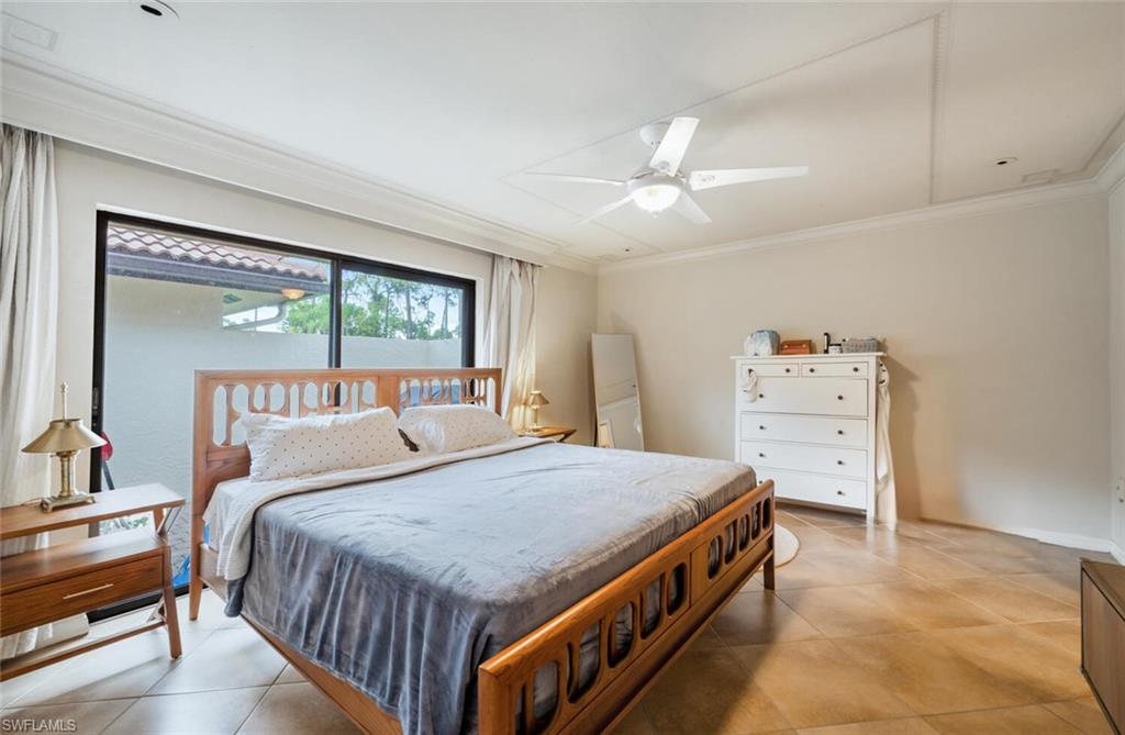 646 Augusta Boulevard Naples, FL 34113 - Photo 8 of 23 a bedroom with a bed and a large dresser