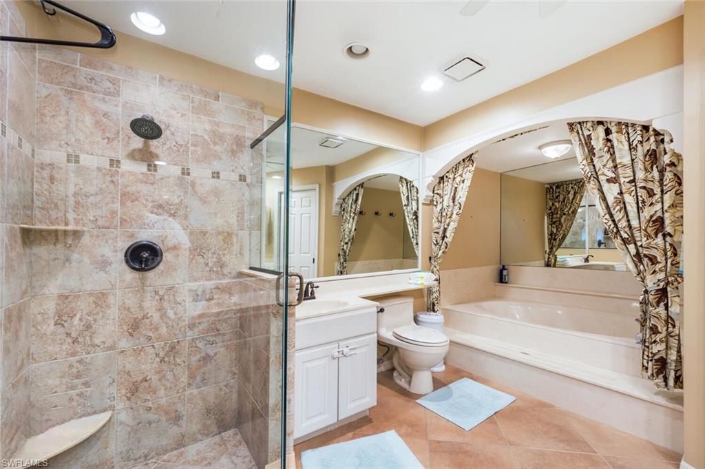 646 Augusta Boulevard Naples, FL 34113 - Photo 10 of 23 a bathroom with a bathtub shower sink mirror and toilet